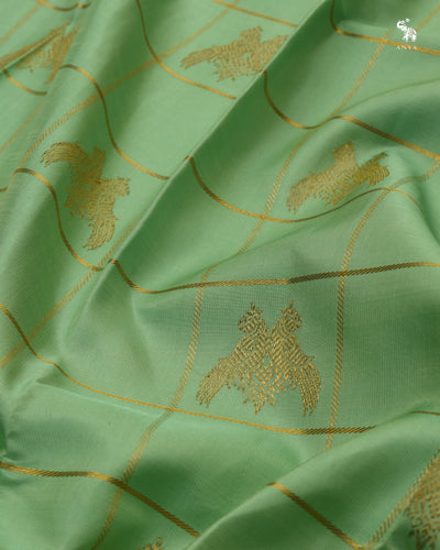 Pastel Green Bridal Kanchi Silk Saree with Zari Kattam and Iruthalaipatchi Butta Design