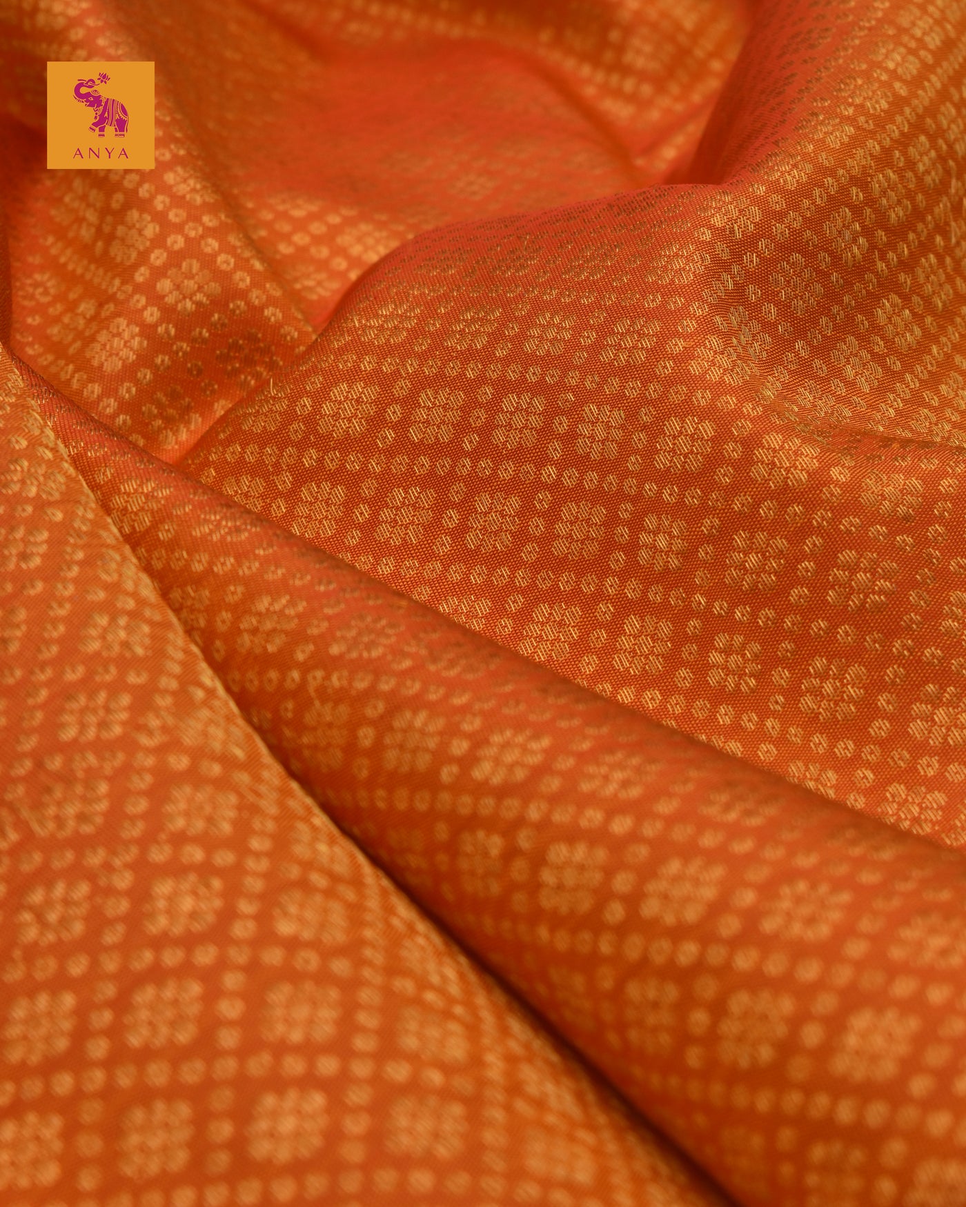 Milagai Orange Kanchi Silk Fabric with Kamalam Butta Design