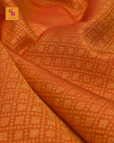 Milagai Orange Kanchi Silk Fabric with Kamalam Butta Design