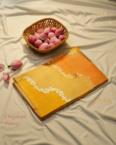 Yellow and Orange Organza Saree with Creeper Design