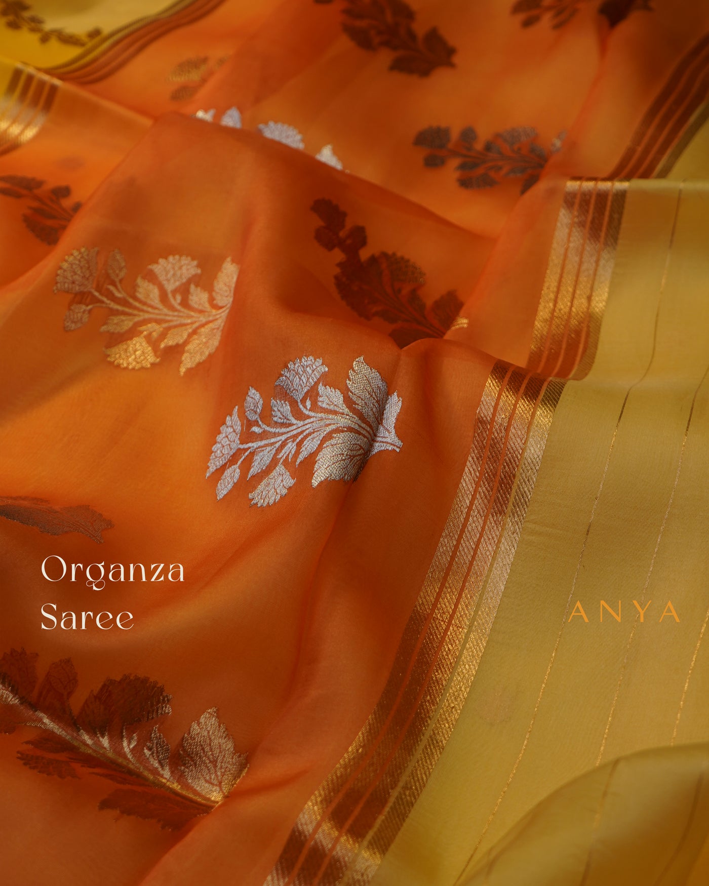 Yellow and Orange Organza Saree with Creeper Design