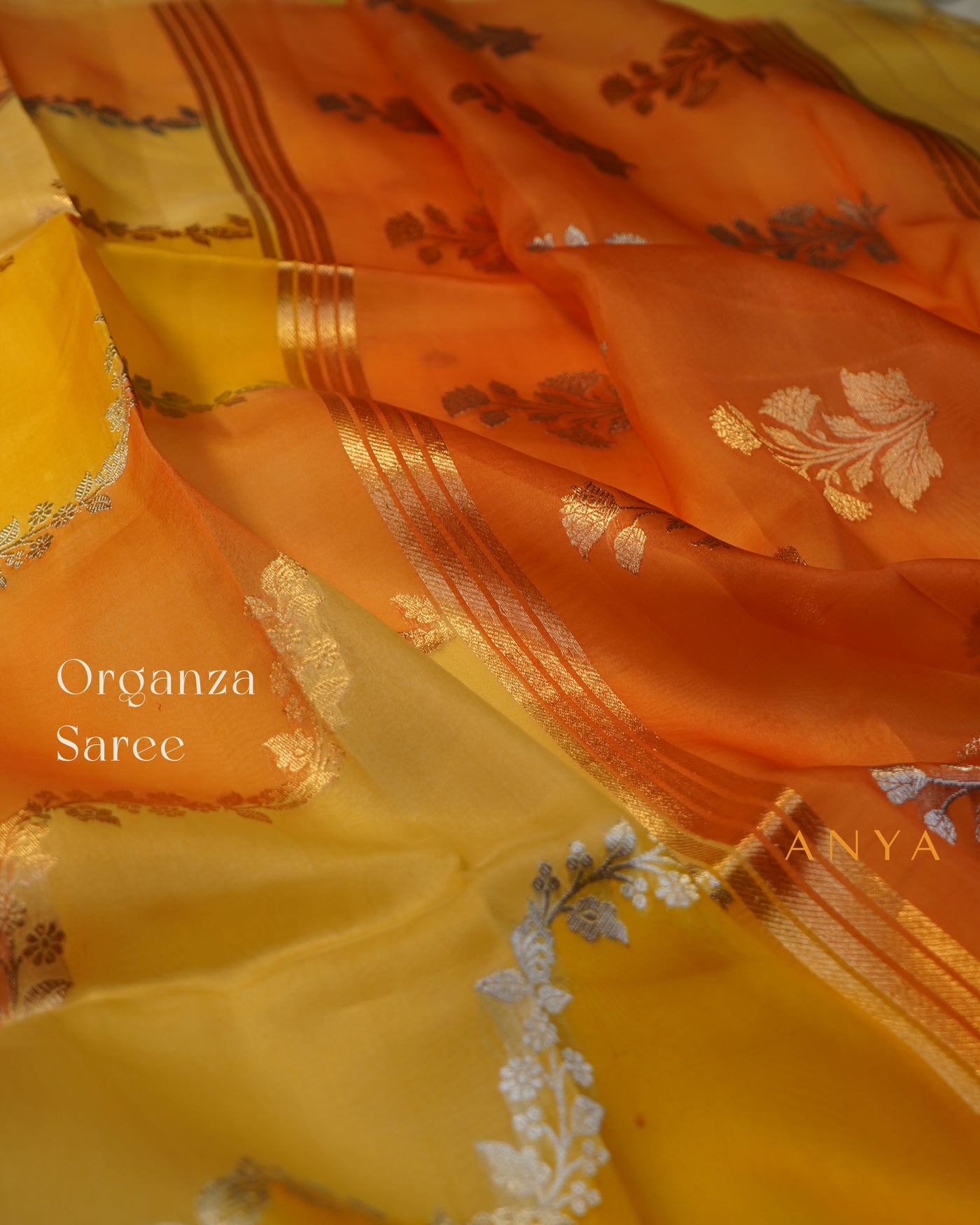 Yellow and Orange Organza Saree with Creeper Design