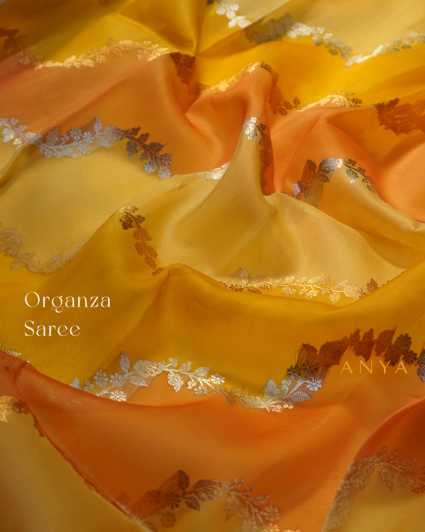 Yellow and Orange Organza Saree with Creeper Design