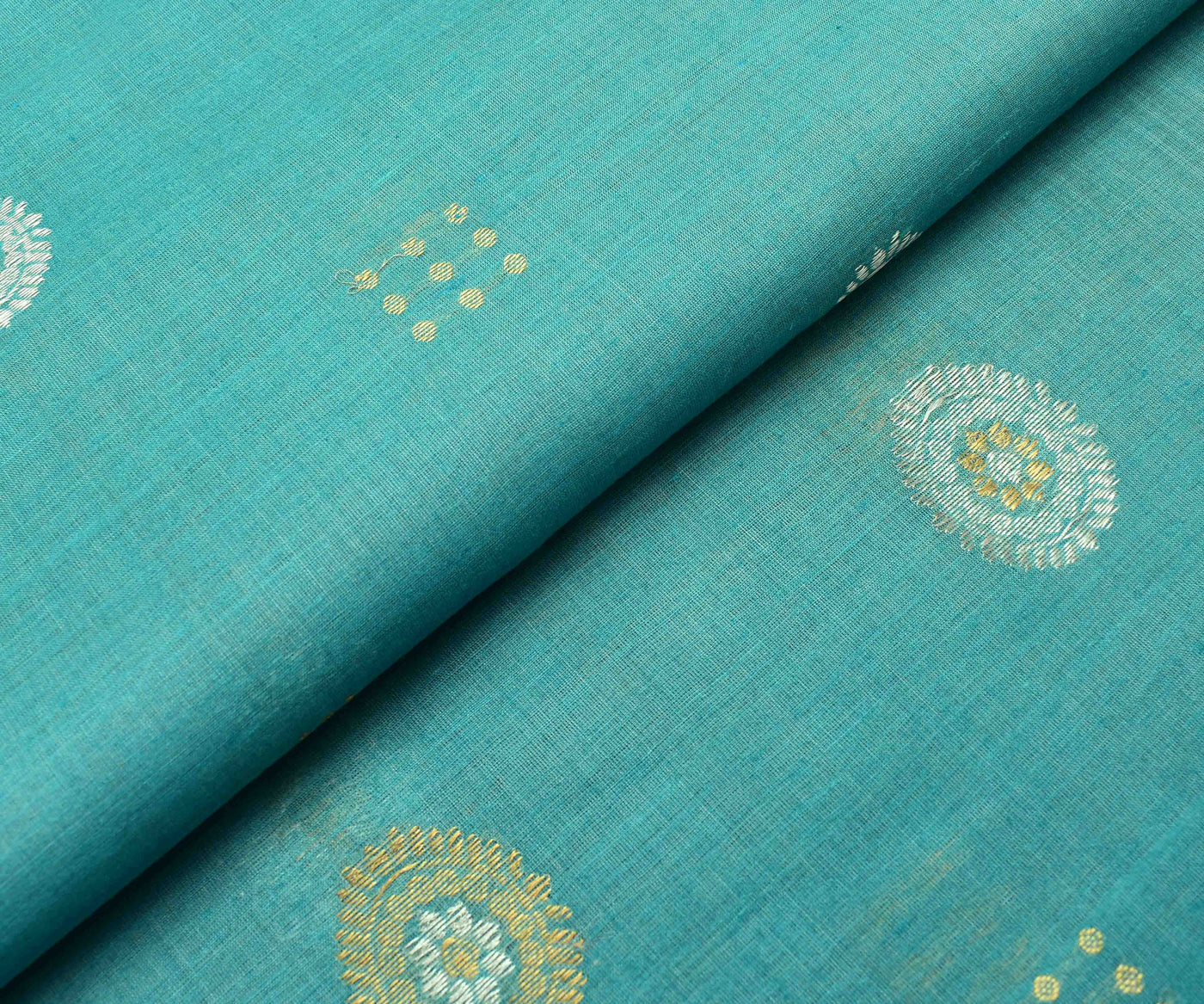 blue-tussar-fabric-with-gold-and-silver-zari-butta-highlights