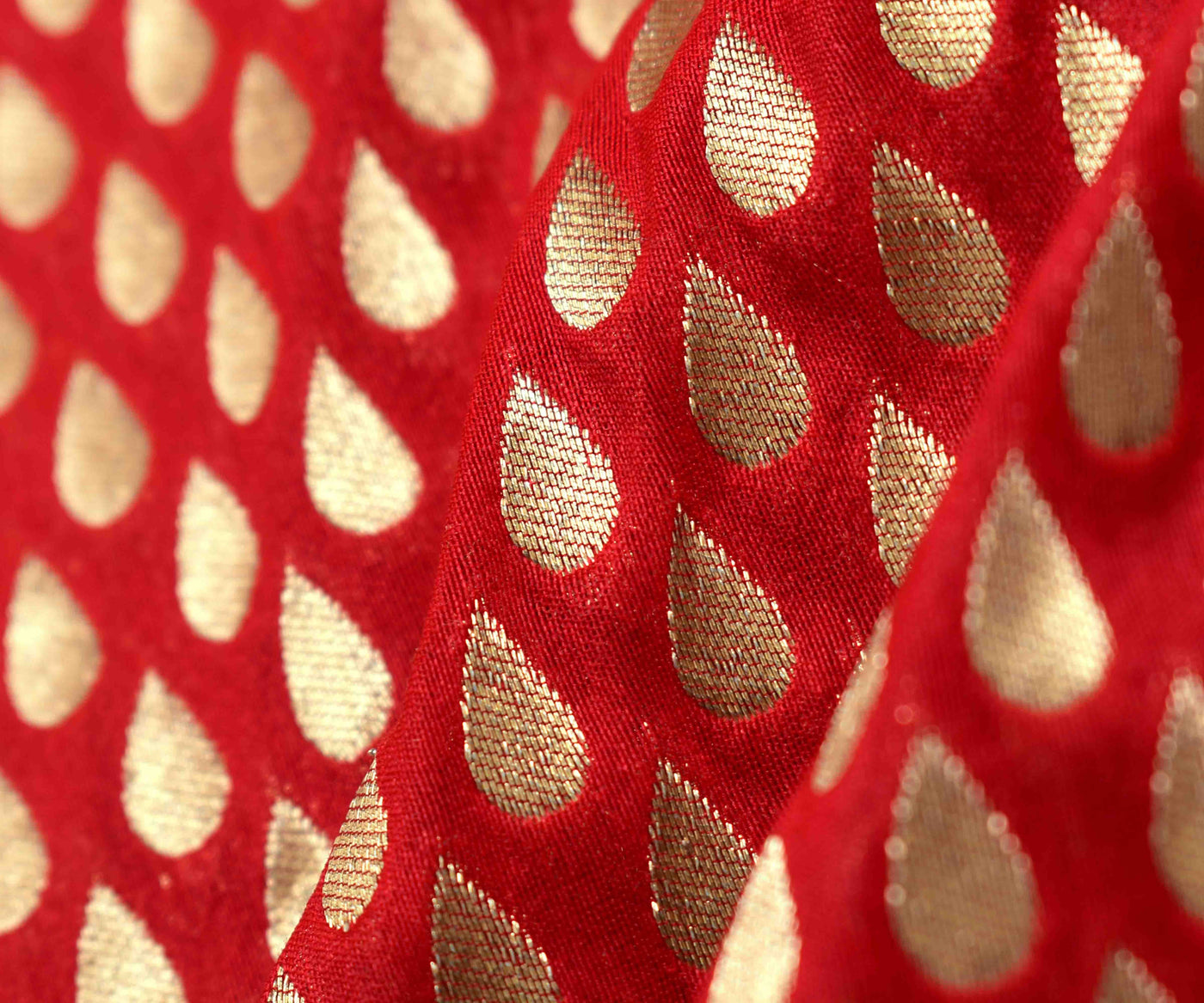 red-banarasi-silk-fabric-with-leaf-gold-zari-butta-design-highlights