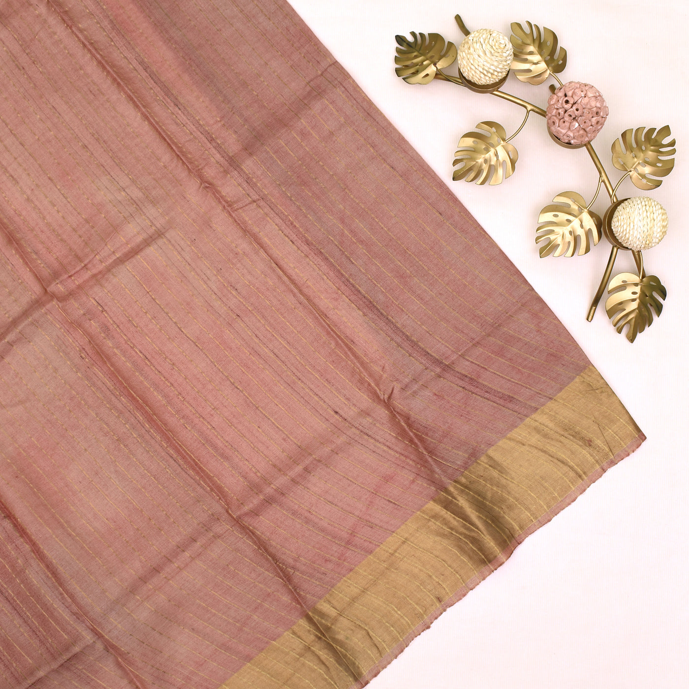 Off White Tussar Printed Saree with Golden Tissue Border in the blouse