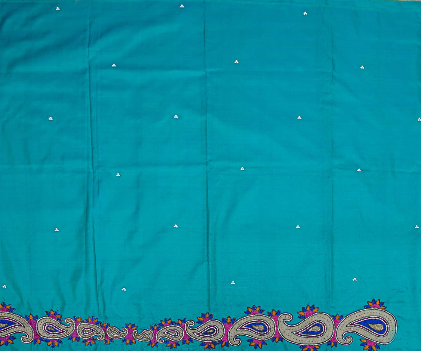 bluish-green-kanchi-silk-saree-crafted-with-mango-zari-load-embroidery-and-swarovski-stone-buttas-all-over-in-saree
